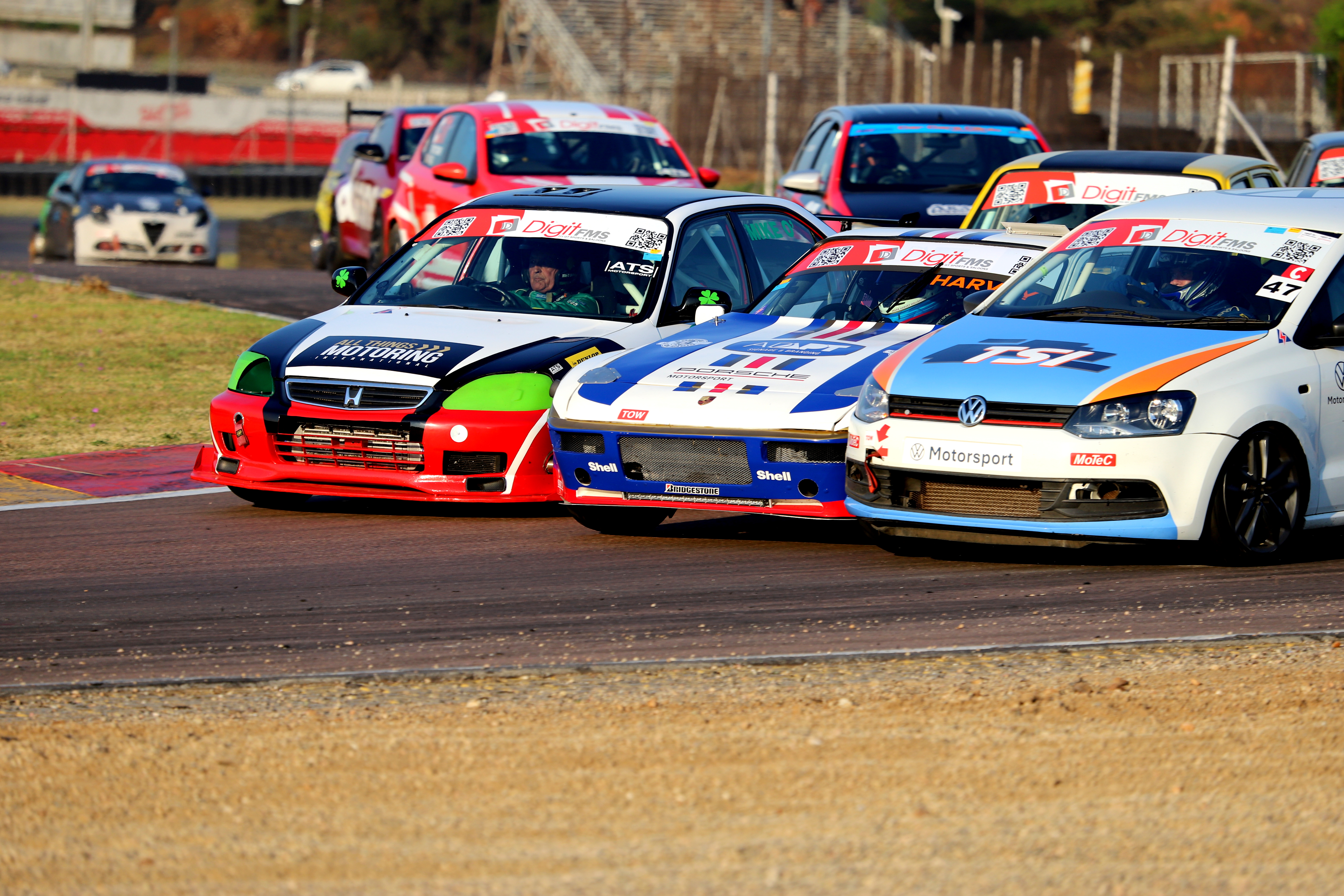 Some very close action in Turn 2 at Zwartkops Raceway